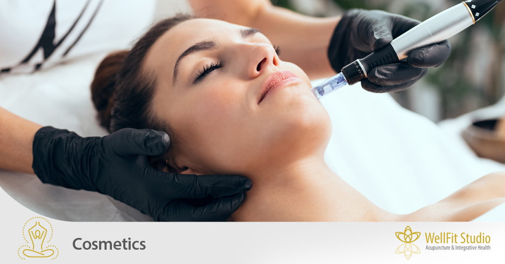 A woman closing her eyes while laying on a bench as a specialist applies a tool to her face as part of a cosmetic treatment